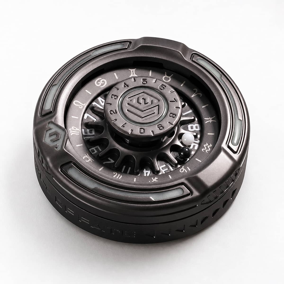 Black metal D20 decision roulette with dual numbered wheels and two steel balls on white.