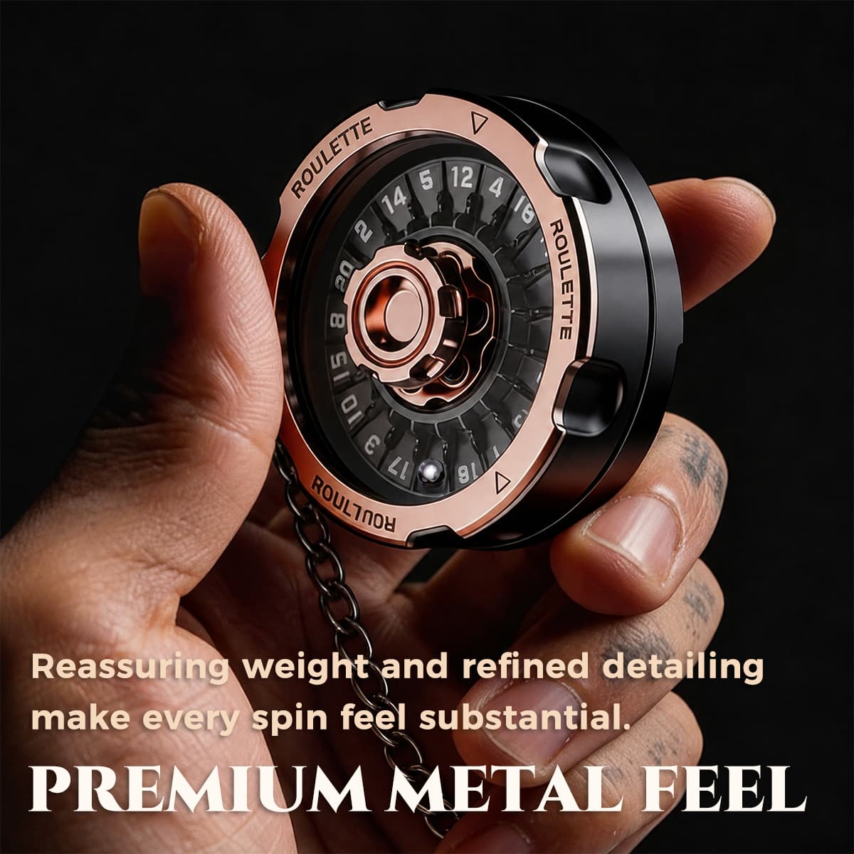 Rose gold and black metal D20 decision spinner held in one hand with its premium finish visible.