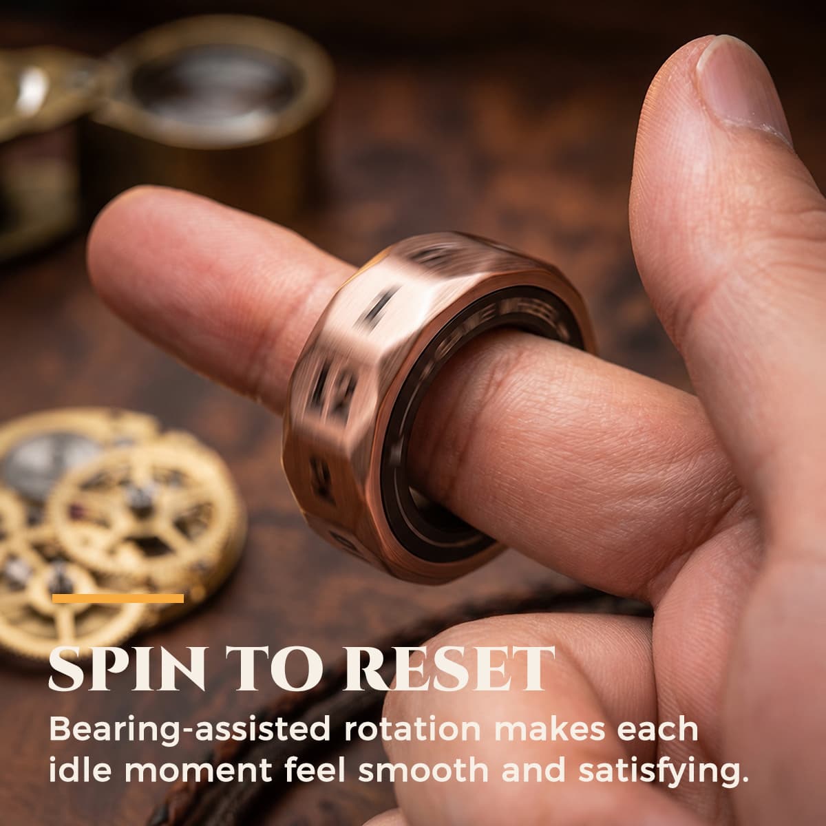 Antique bronze D12 decision ring spinning around a finger.