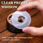 Hand holding the clear protective window above a bronze D20 roulette spinner.