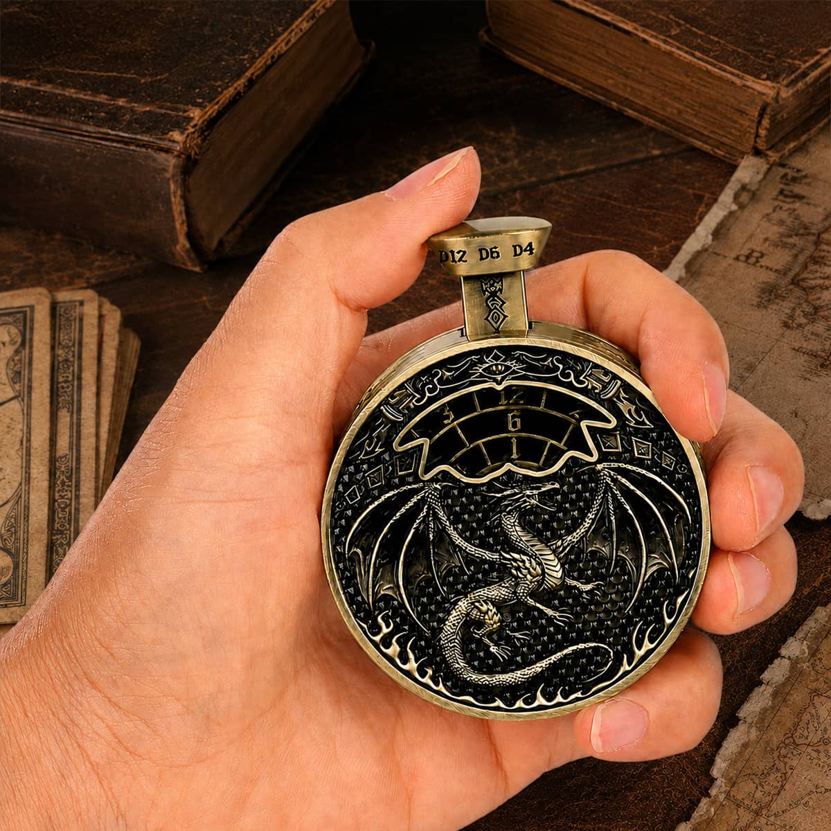 Hand holding an antique bronze pocket press dice with dragon relief and number selector.