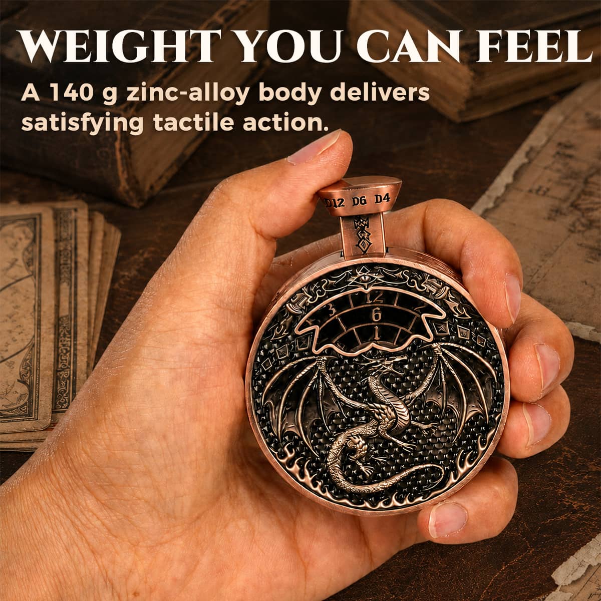 Hand holding a 140 g antique copper pocket press dice with raised dragon relief.