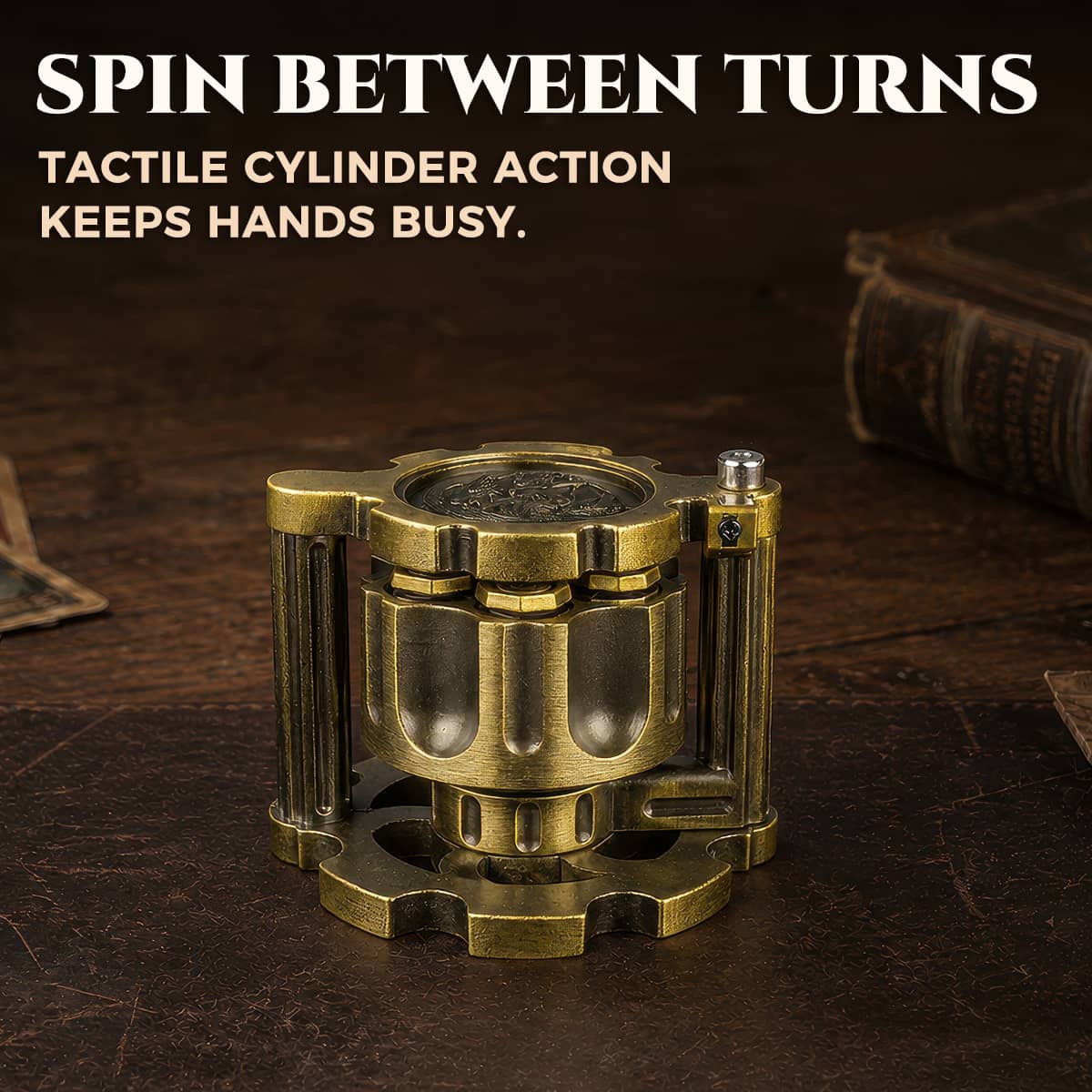 Closed antique gold reloadable dice cylinder standing upright on a leather tabletop.