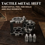 Open antique silver metal dice cylinder with seven bullet-shaped RPG dice on a tabletop.
