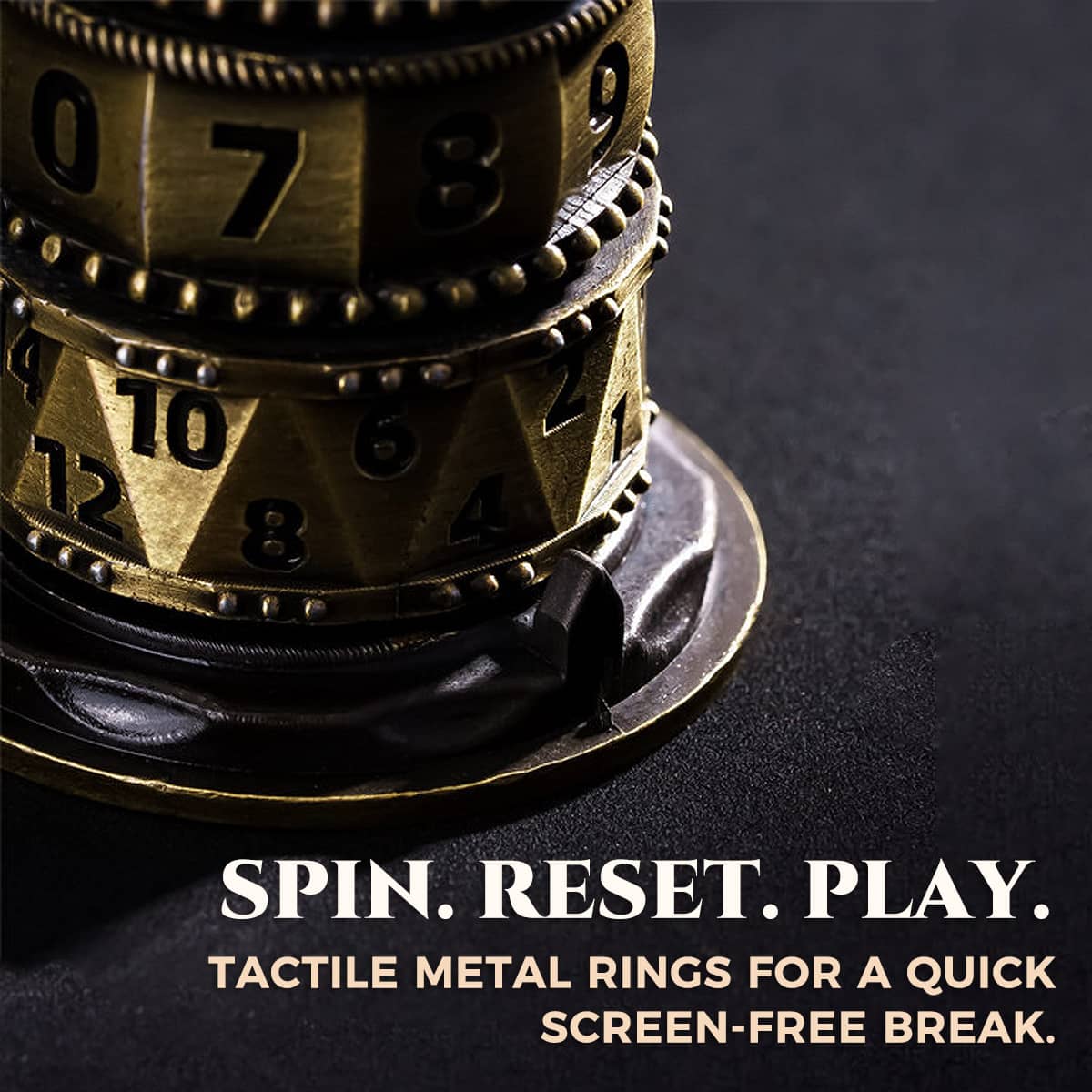 Close-up of antique bronze numbered spinner rings above the metal display base.