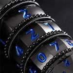 Macro view of black metal RPG spinner rings with bright blue numbers.