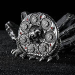 Silver 7-in-1 dragon dice spinner displayed on a sculpted dragon claw stand.