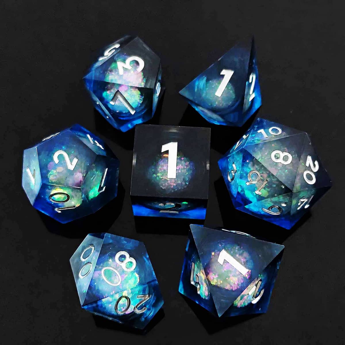 Midnight Blue liquid-core RPG dice set with deep blue resin and white numbers on black.