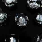 Onyx liquid-core RPG dice set with black and silver glitter and white numbers on black.