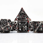Silver Abyssal hollow metal RPG dice set with red accents and gothic tentacle openwork.